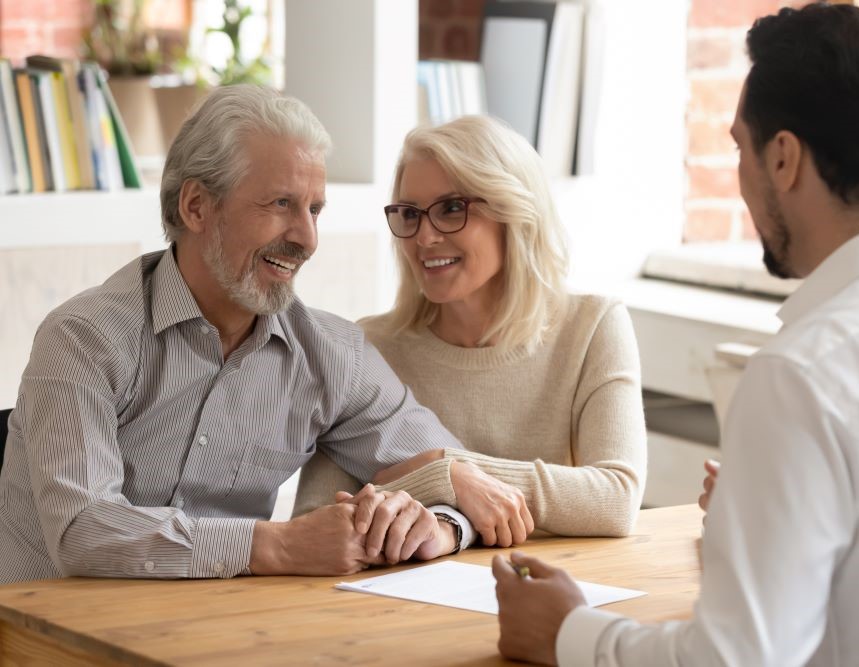 Senior couple consulting with an agent