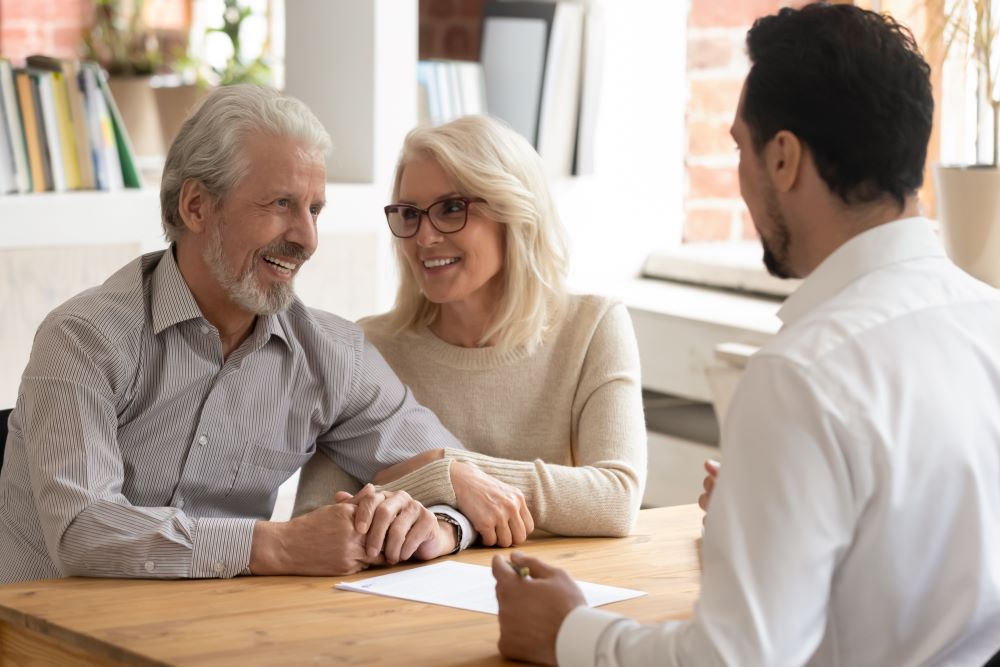 Senior couple consulting with an agent