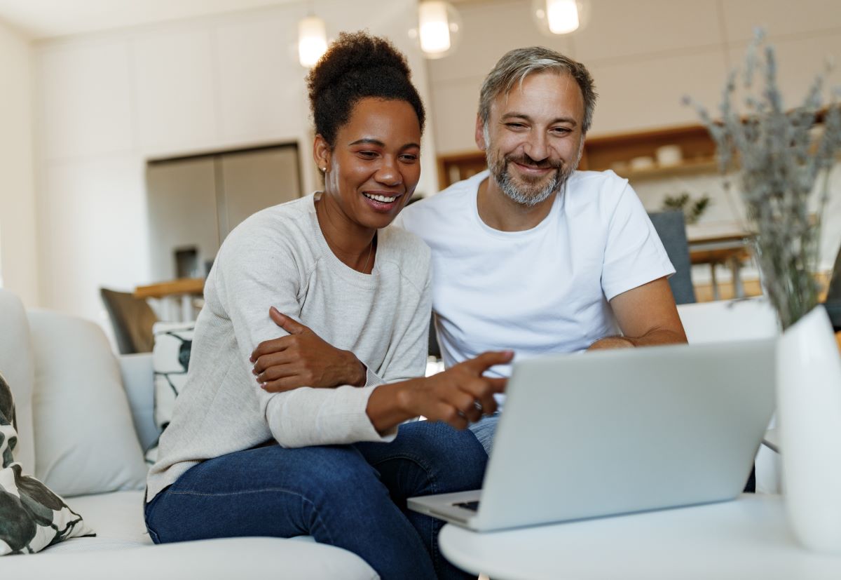 Couple reviewing something on a laptop
